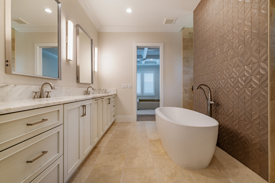 Newly installed bathroom countertops in a modern bathroom featuring clean lines, sleek surfaces, and contemporary fixtures.